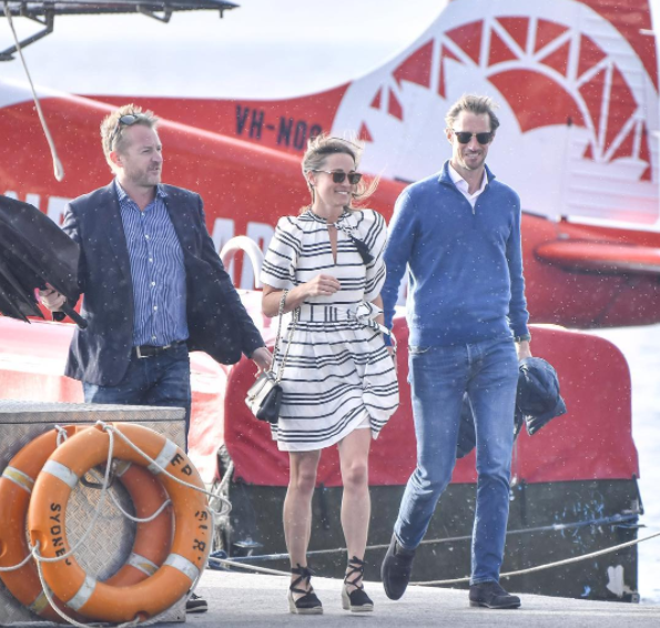 Sydney Seaplanes CEO Aaron Shaw escorts Pippa Middleton and new husband James Matthews off their flight.
