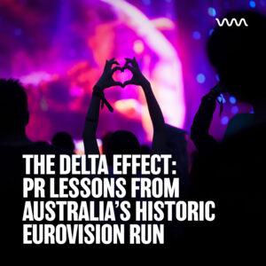 Audience hands forming a heart shape at a live concert with vibrant purple and pink stage lighting in the background, and bold white text overlaid at the bottom.